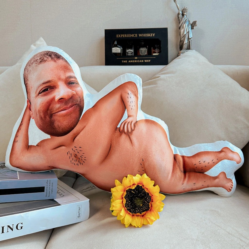 Custom funny face photo pillow reclining on a sofa